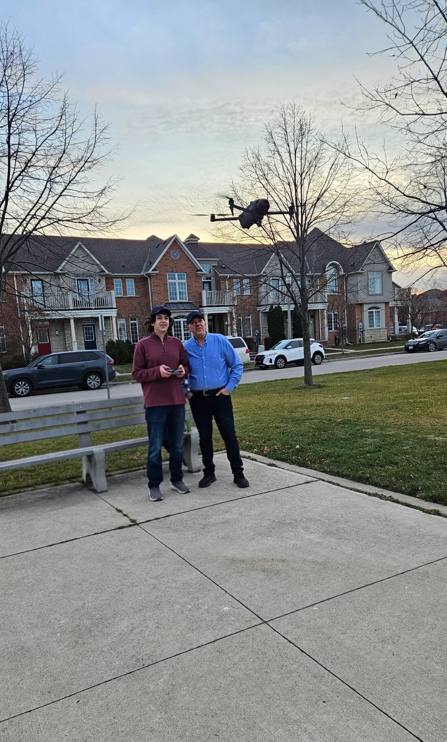 Founder and son preparing a drone for flight, RCG Canada