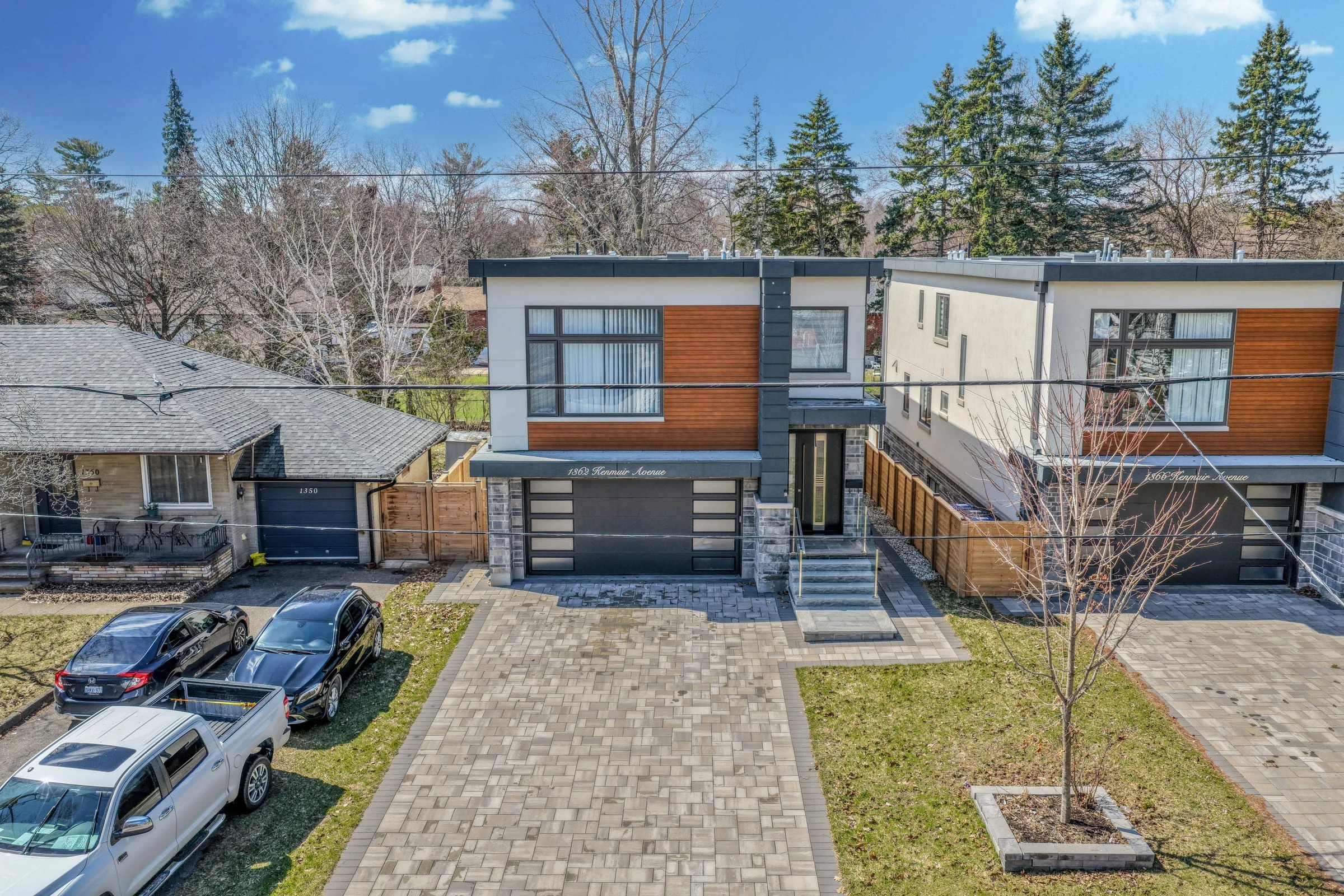 Drone aerial view of a custom-built Mississauga home and driveway among mature trees, showcasing the property’s street presence. RCG Canada real estate photography